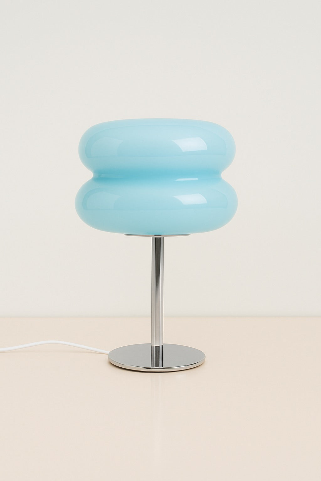 Light blue glass table lamp with soft sculptural form